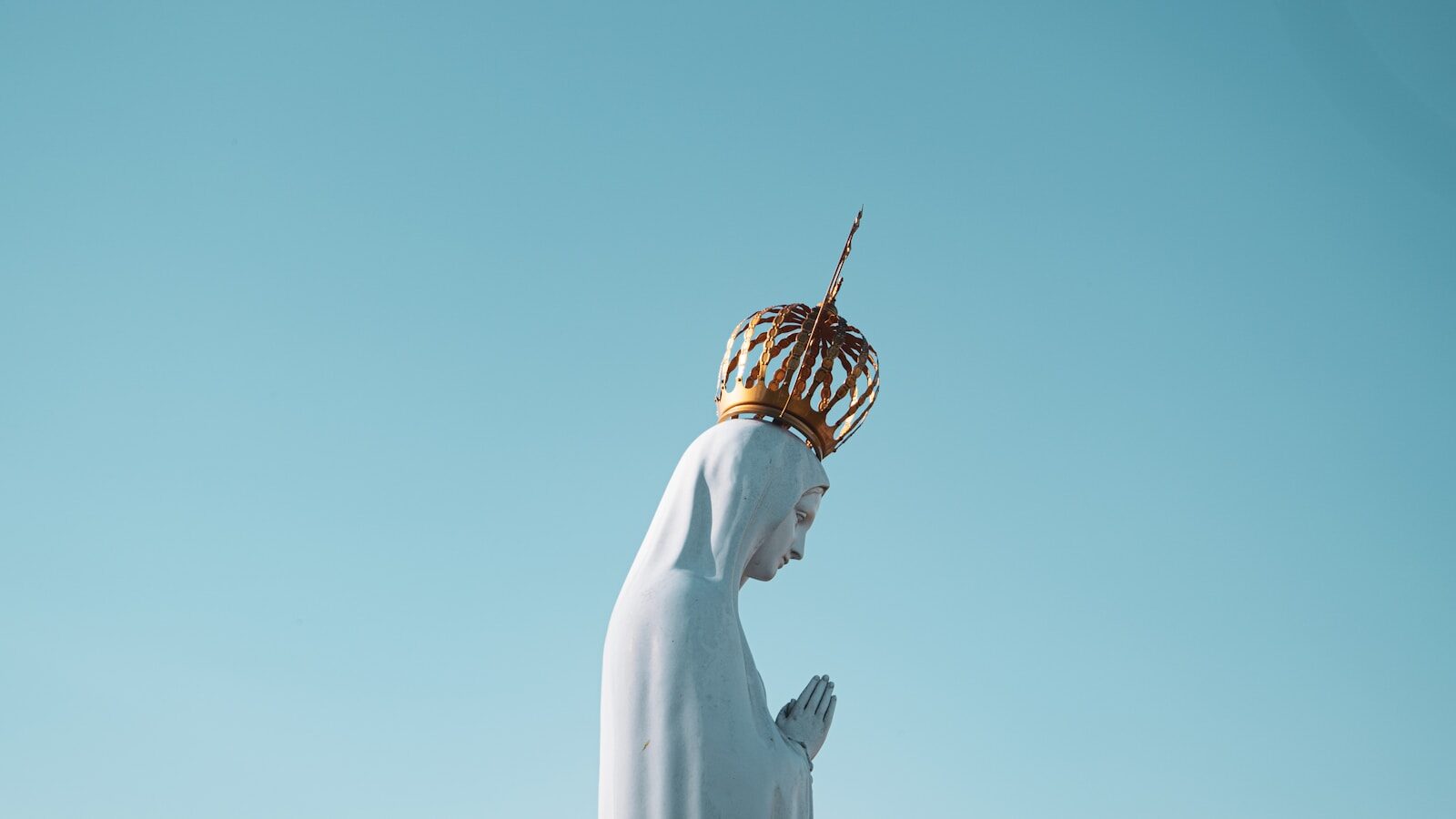 Photo by Mateus Campos Felipe Mama Mary statue
